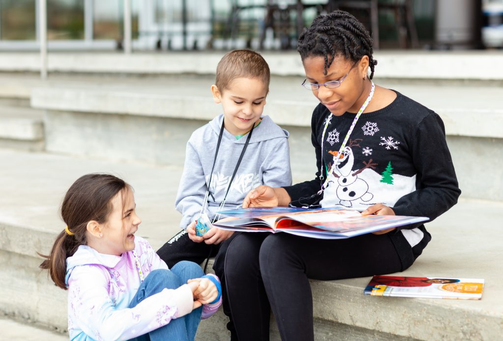 children reading books together