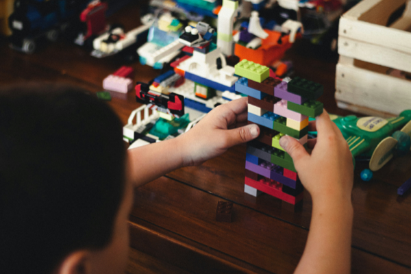 boy with autism playing with legos