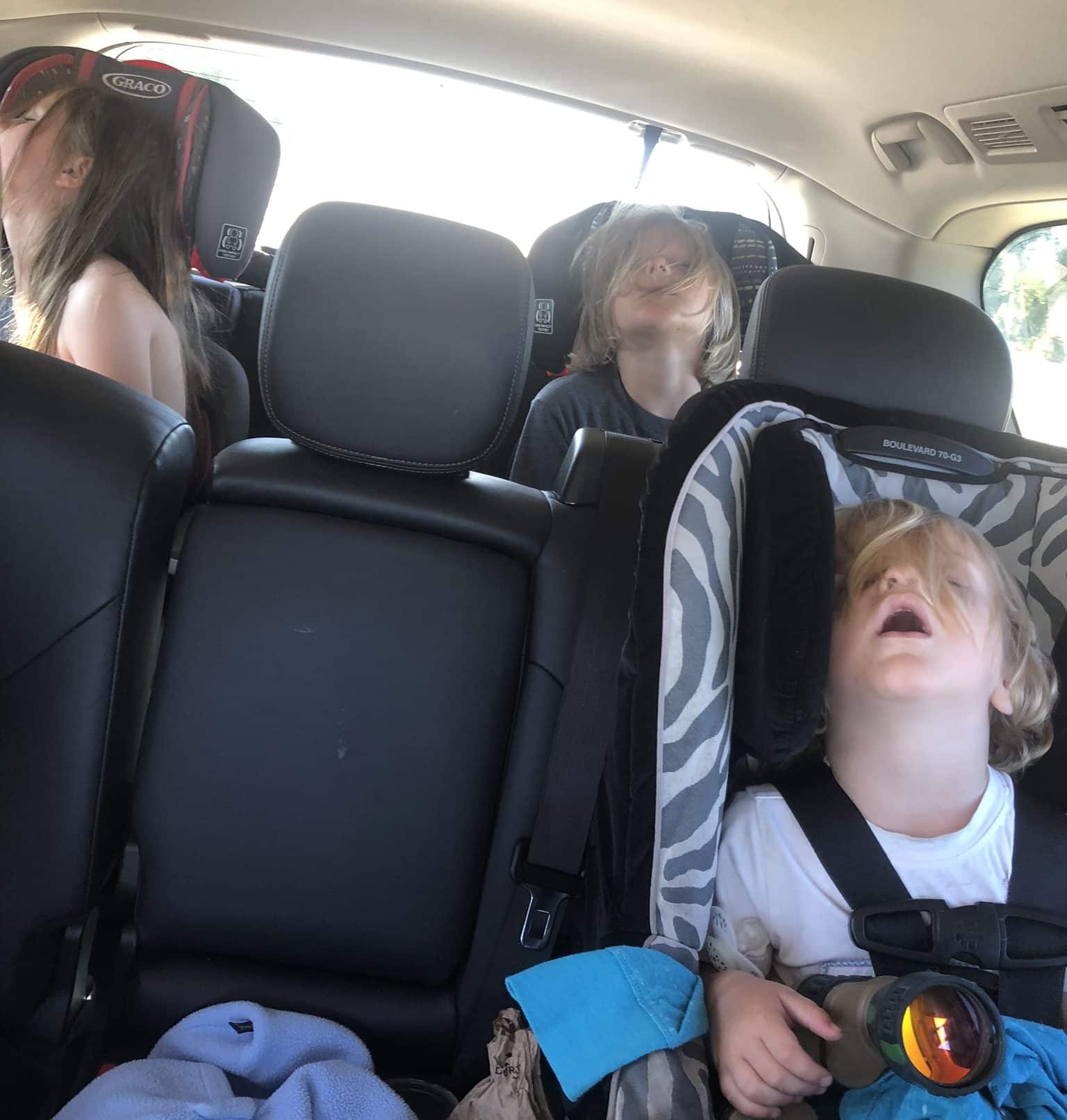 kids asleep in the car after the Parker Homestead Festival