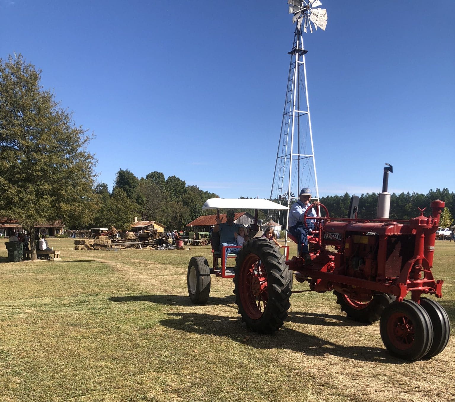 riding a tractor at the Parker Homestead Festival 