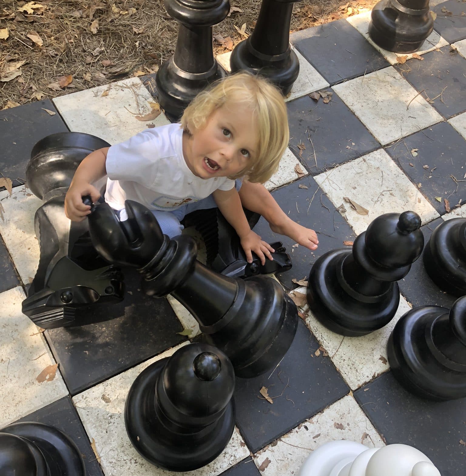 playing with giant chess pieces 