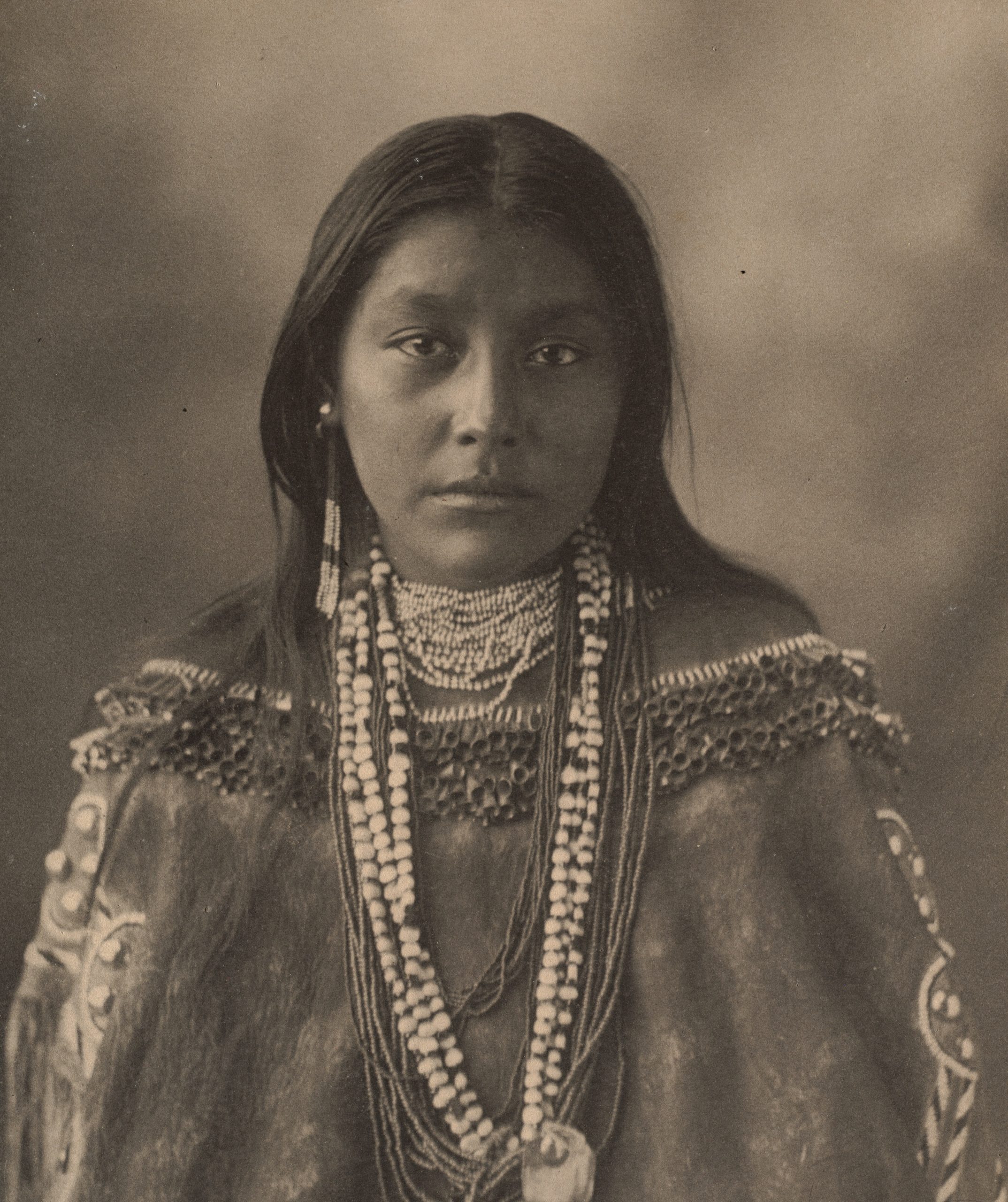 Black and white photograph of a woman with darker, Native American toned skin