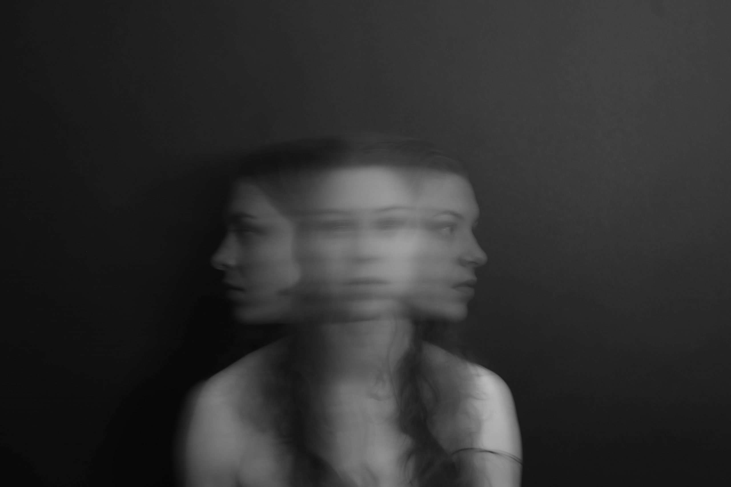 blurred action photo of a woman turning her head side to side