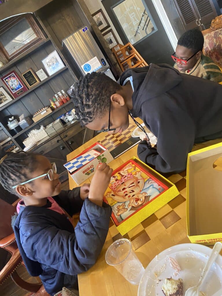 my kids playing Operation at Memphis Chess Club
