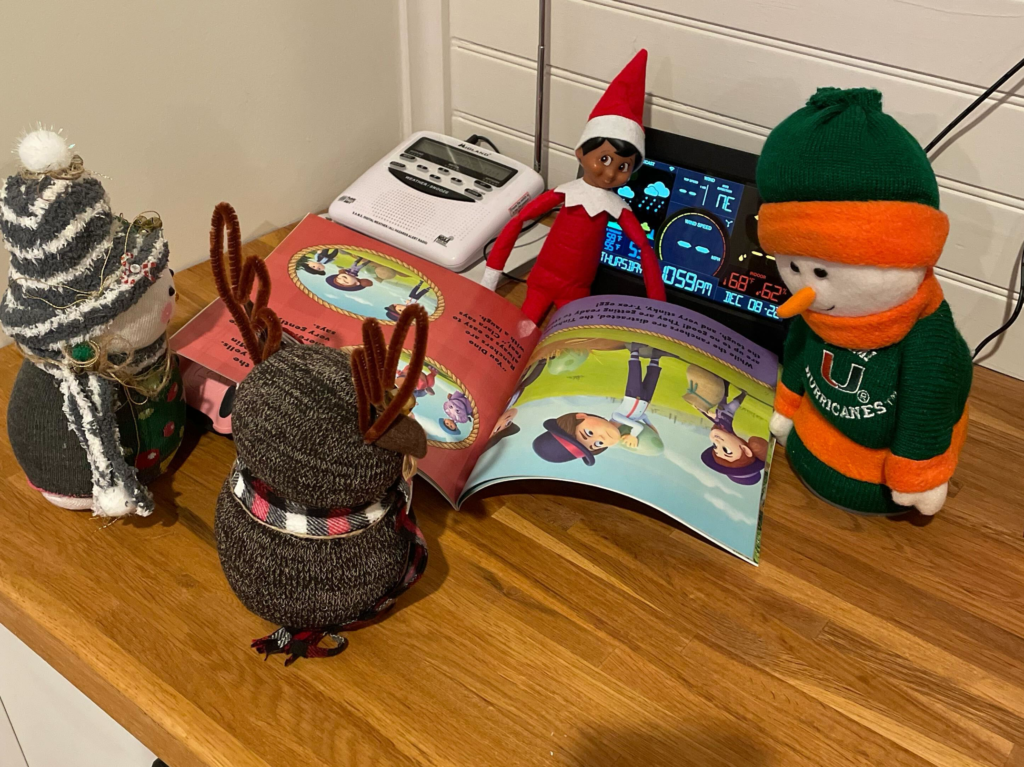 the elf reading with friends