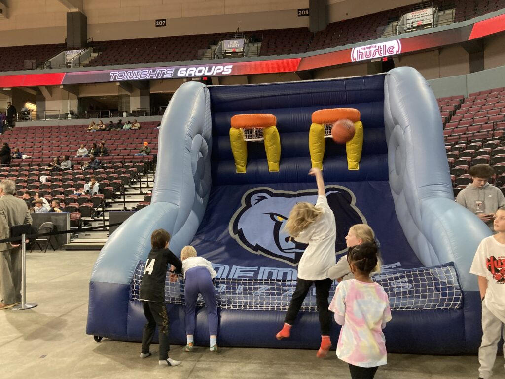 shooting hoops at the Hustle game