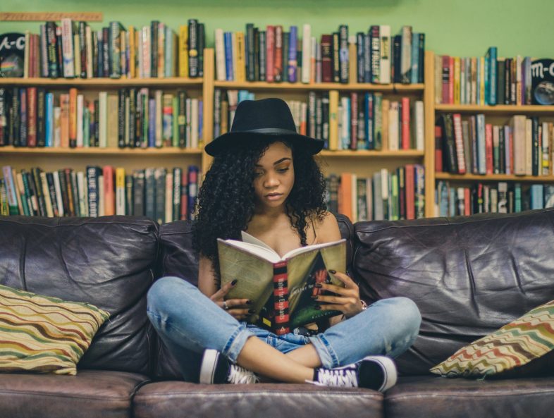 girl reading on a couch