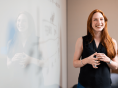 smiling teacher by the whiteboard