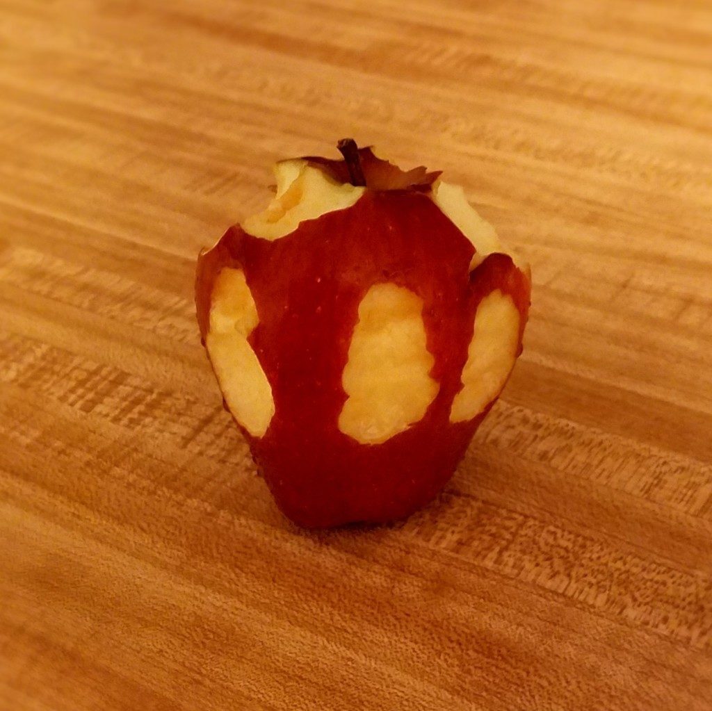 Apple with bites taken from it