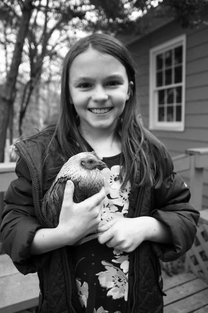 our entrepreneur is right at home with the chickens