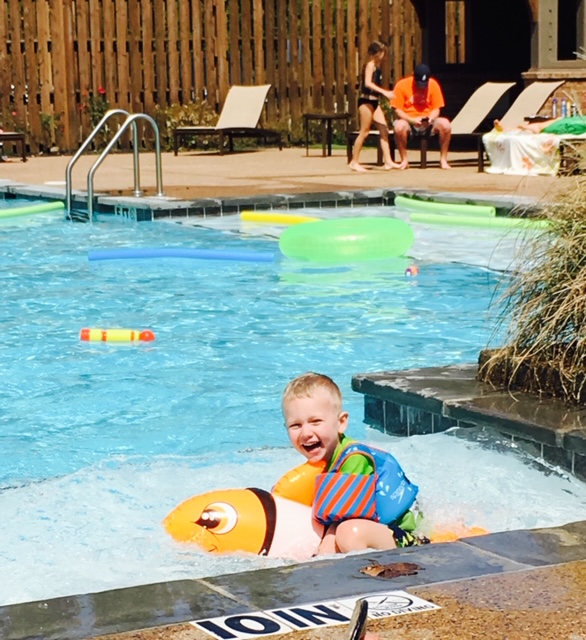 drowning safety, boy with a puddle jumper 