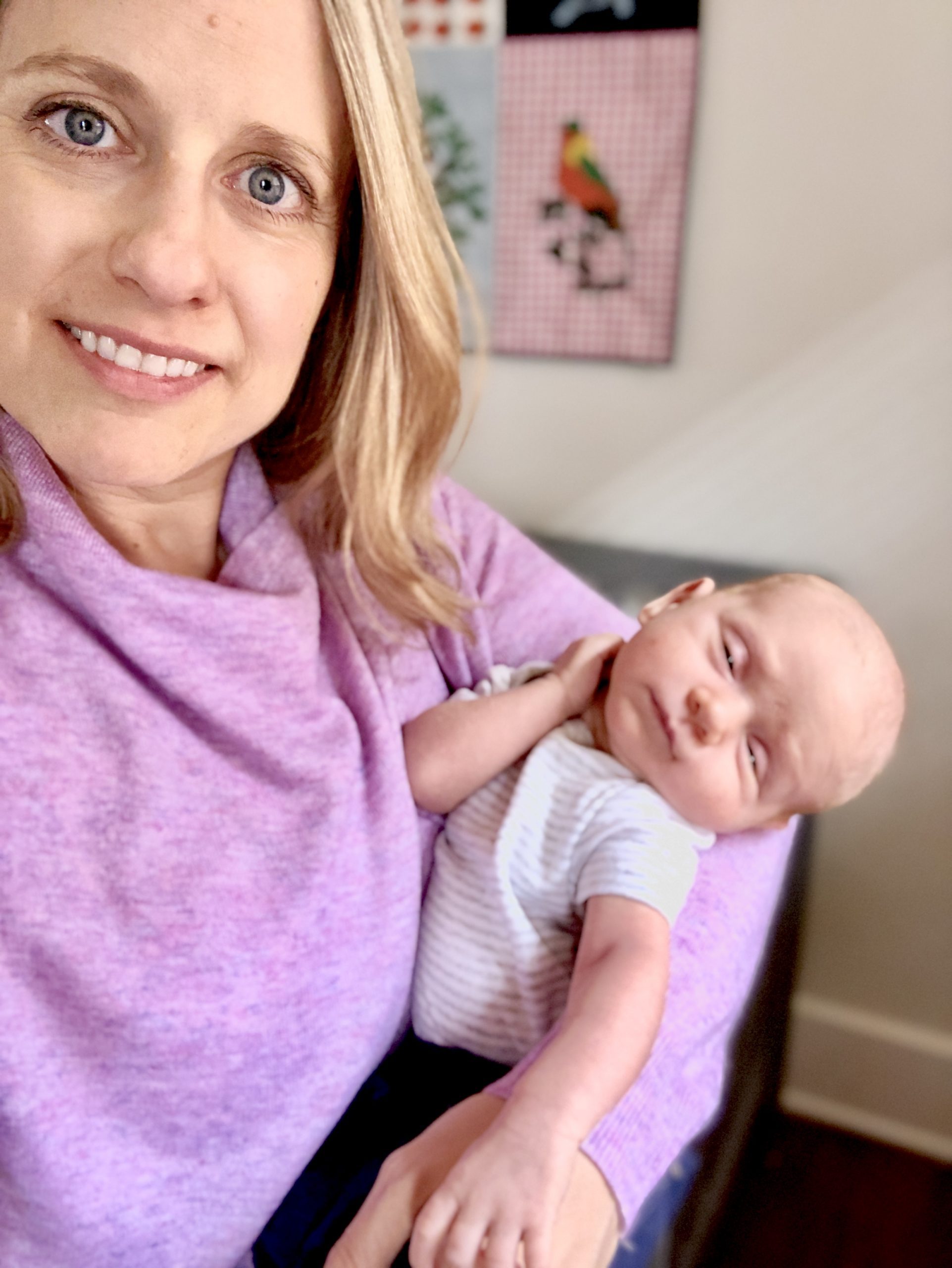 old mom holding a baby