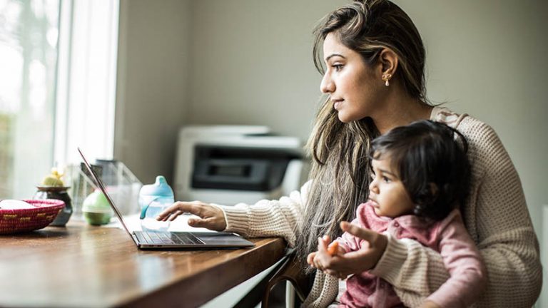 working mother with child on lap