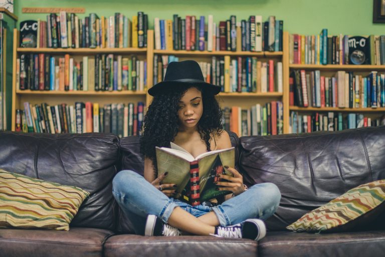 girl reading on a couch