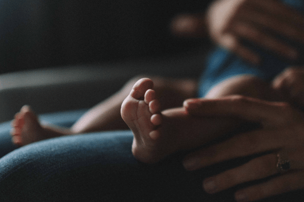 baby with mother on maternity leave