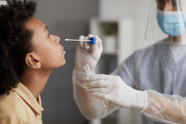 nurse giving a patient a Covid test