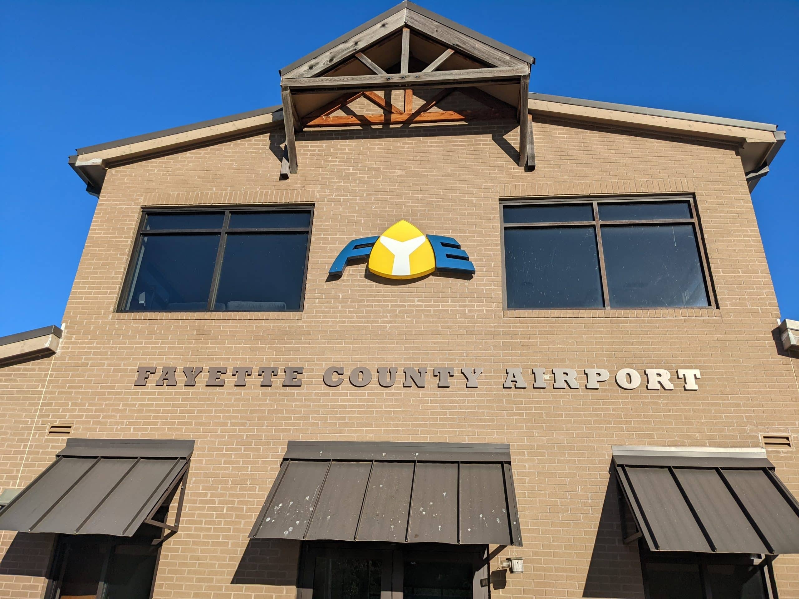 Brick building with Fayette County Airport sign