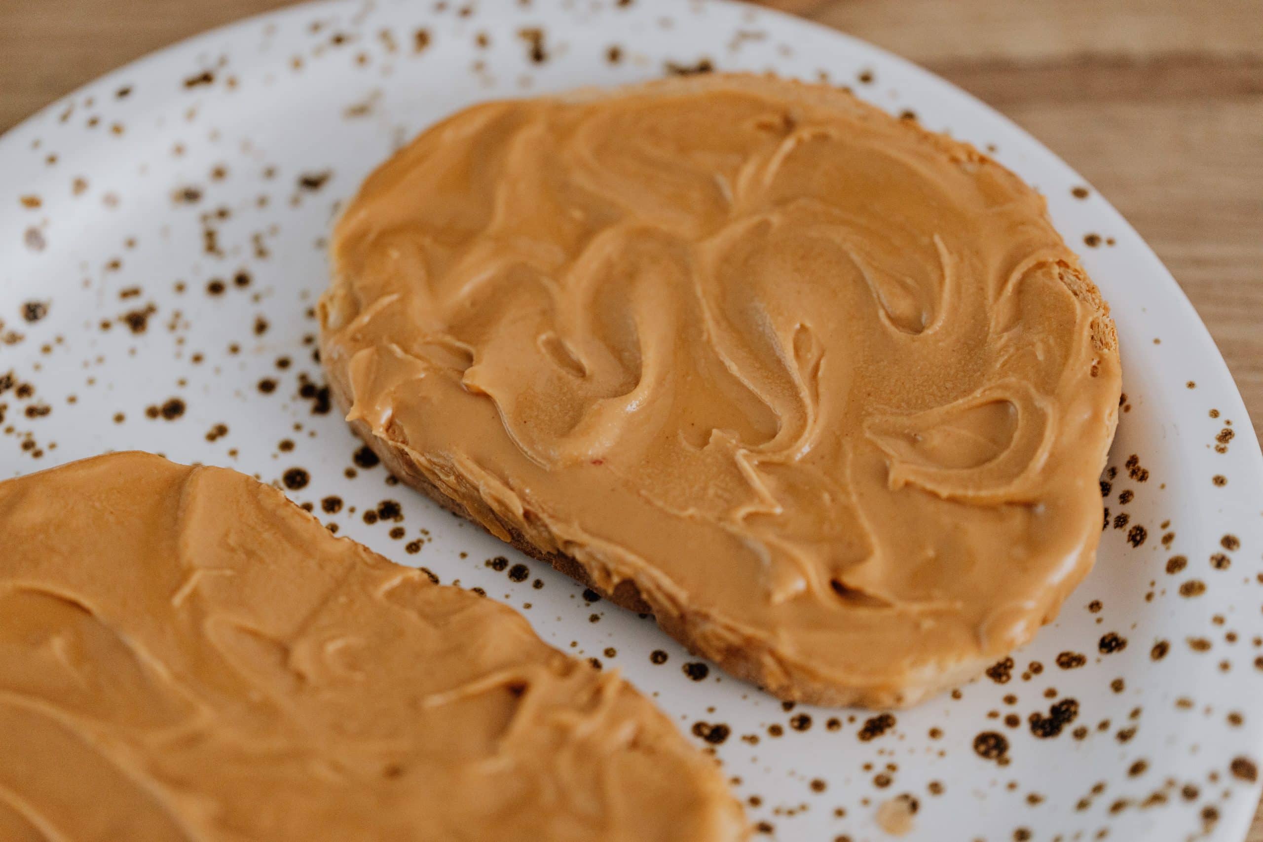 Picture of two pieces of bread with peanut butter containing xylitol on them.