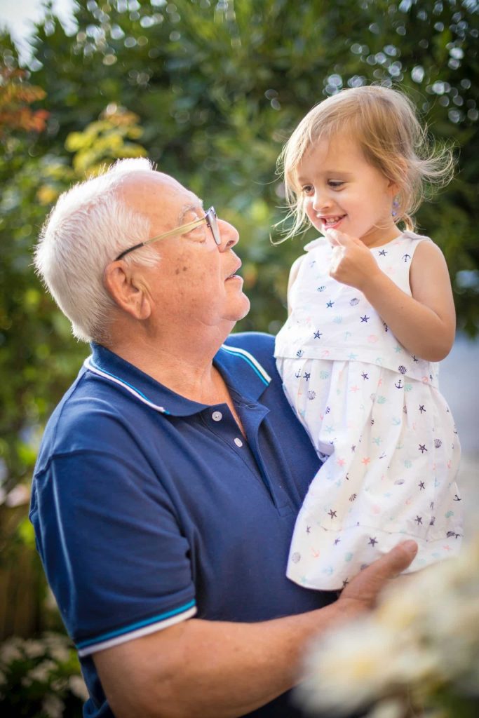 child with her grandfather
