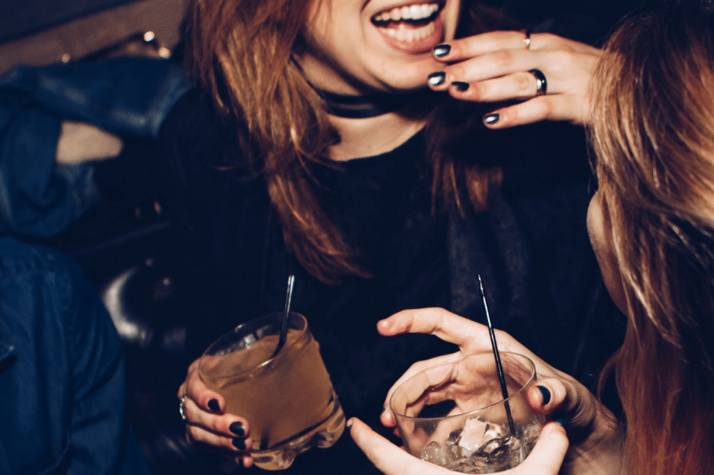 woman having a drink at a party needs sobriety 