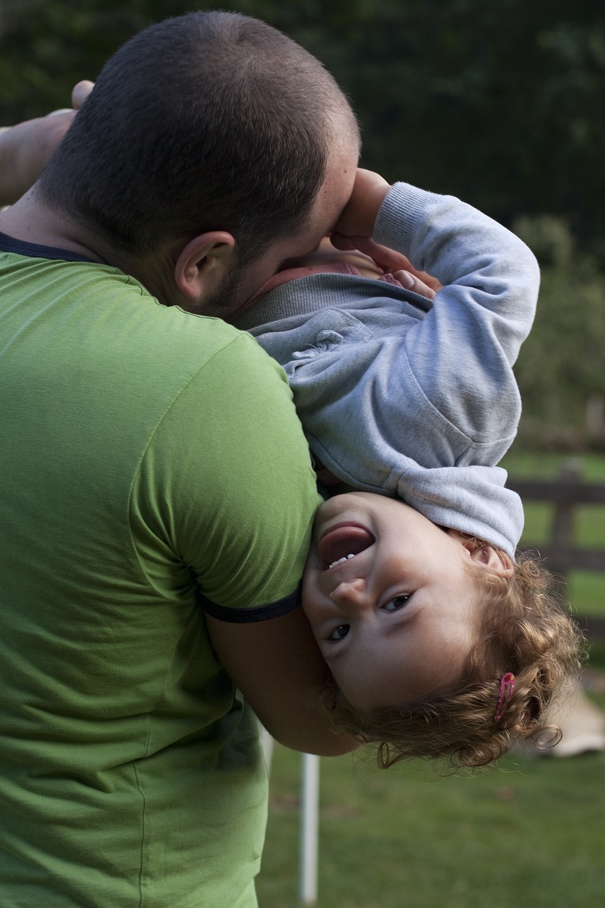 dad playing with their child