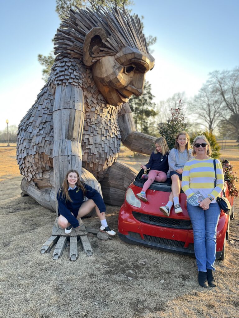 a family in front of the trolls