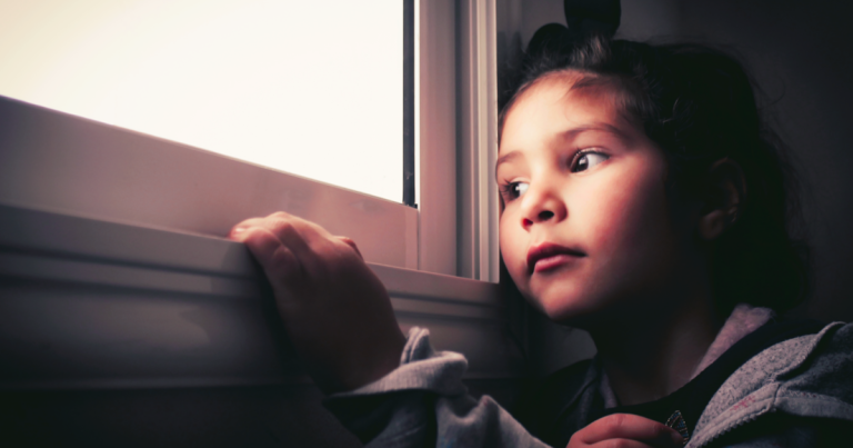 child looking out the window