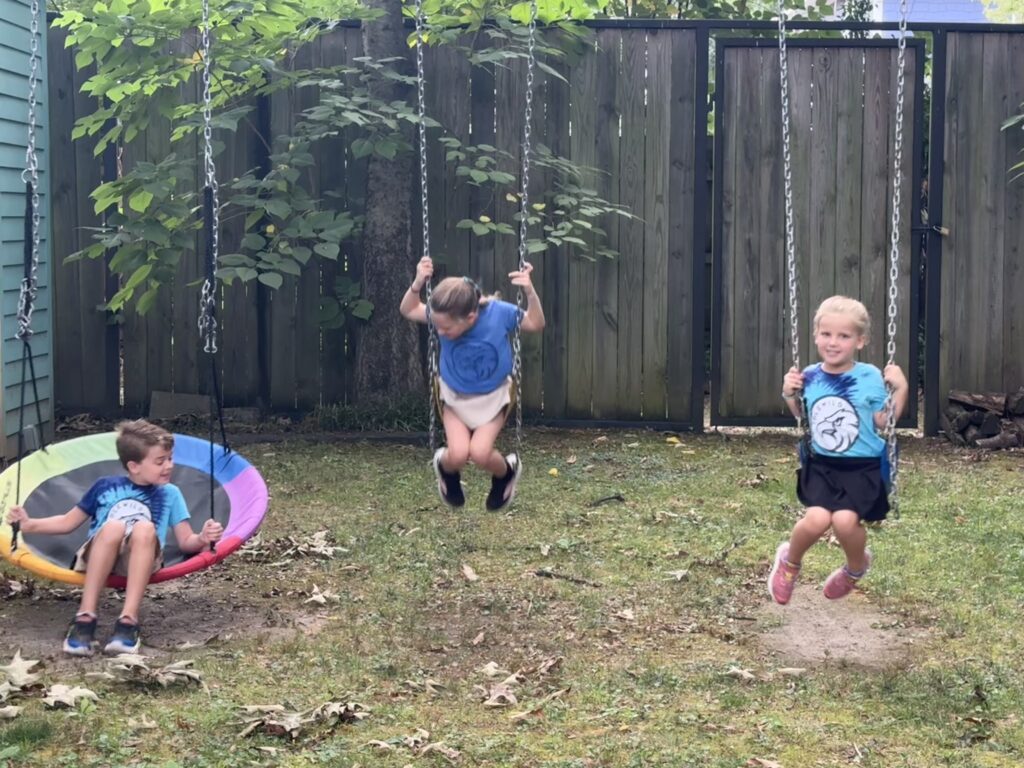 swinging in the backyard before school means we'll probably be late