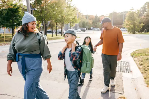 family walking into school