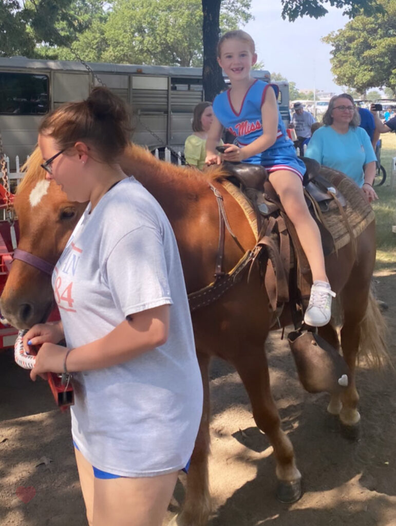 riding a horse at the Pink Palace Crafts Fair