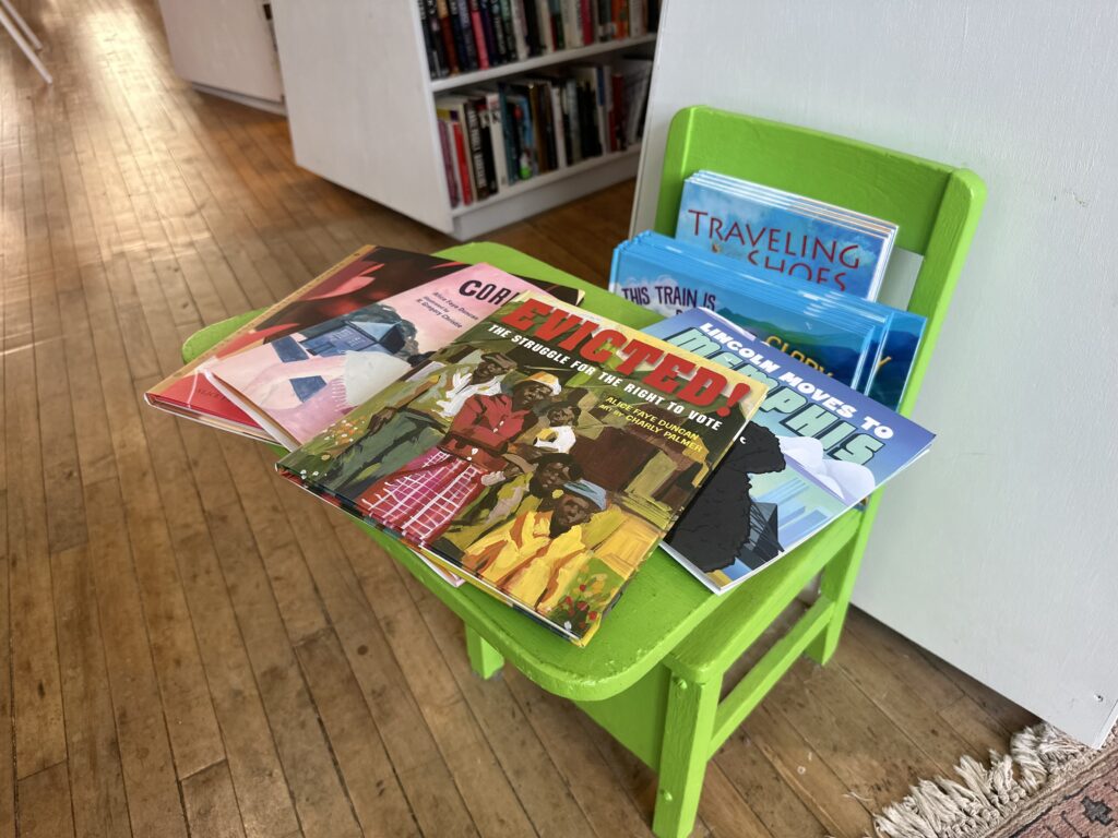 book juggler children's books on a chair