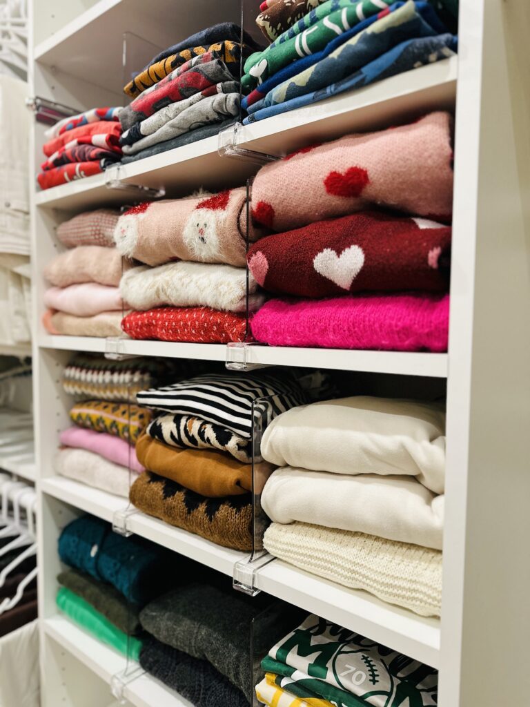 acrylic shelf divider to get organized in a closet