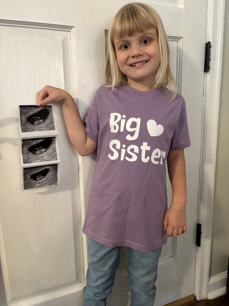 big sister with ultrasound pictures