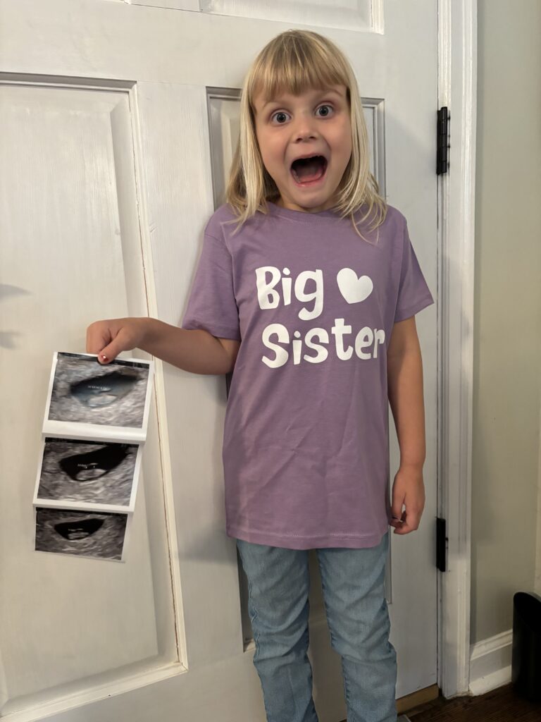 big sister with ultrasound pictures