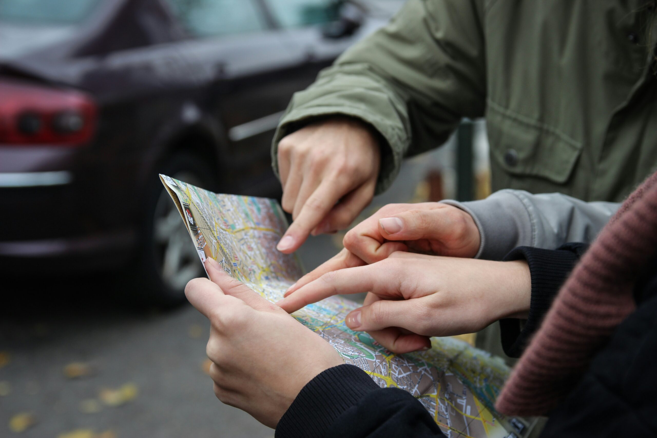 Fingers pointing at a map