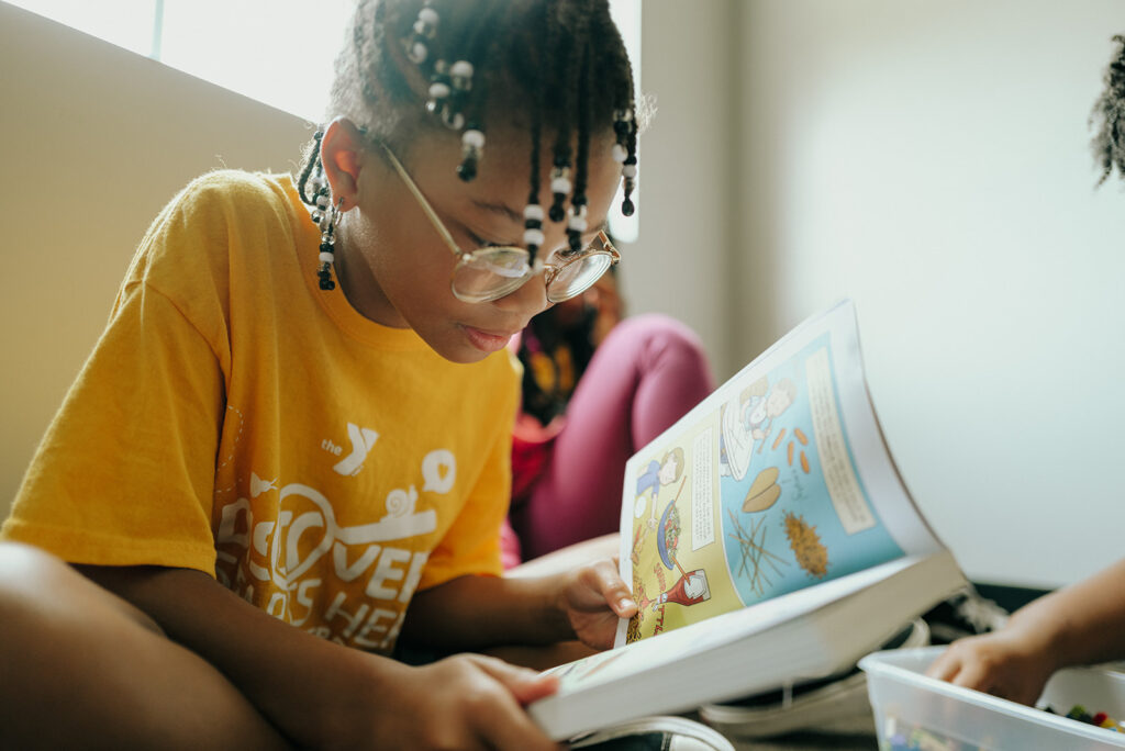 YMCA summer camp girl reading