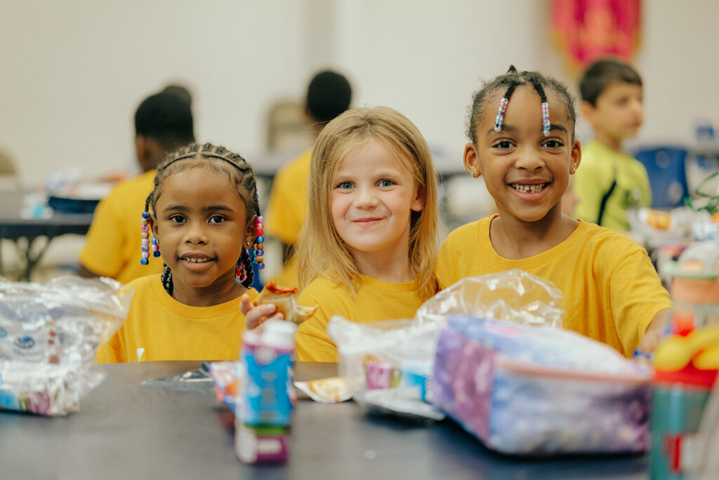 three kids at camp at the YMCA