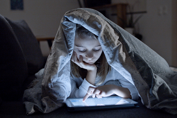 child looking a ipad