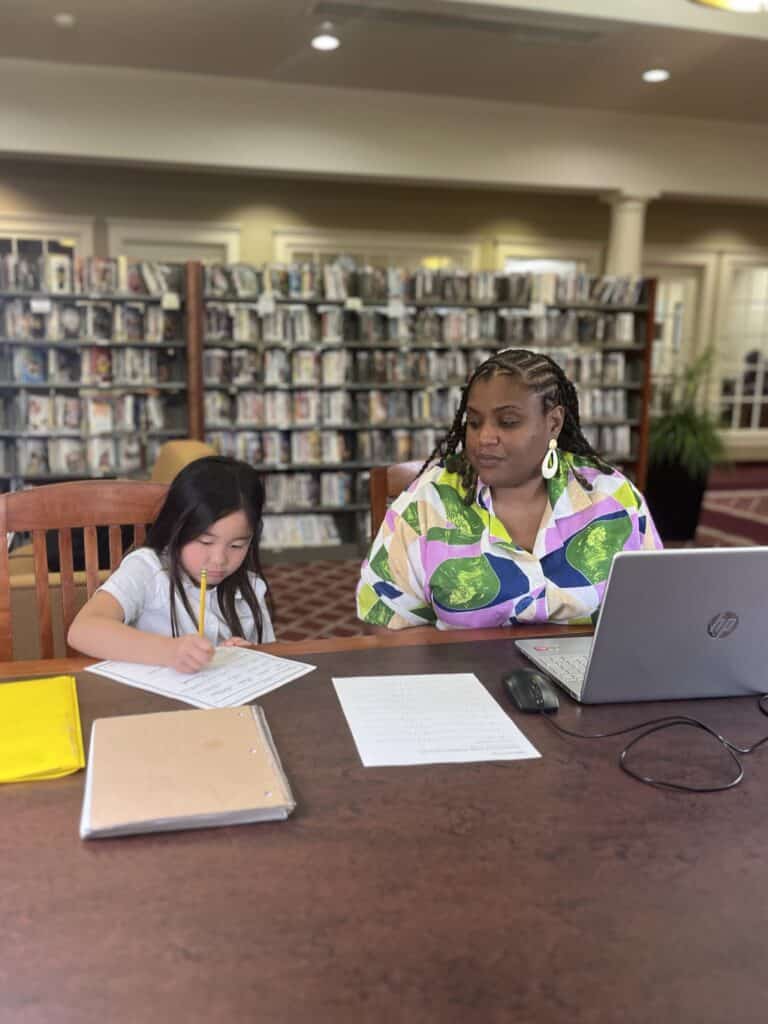 younger student getting tutored